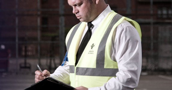 Armour Security property inspector conducting thorough inspection with checklist